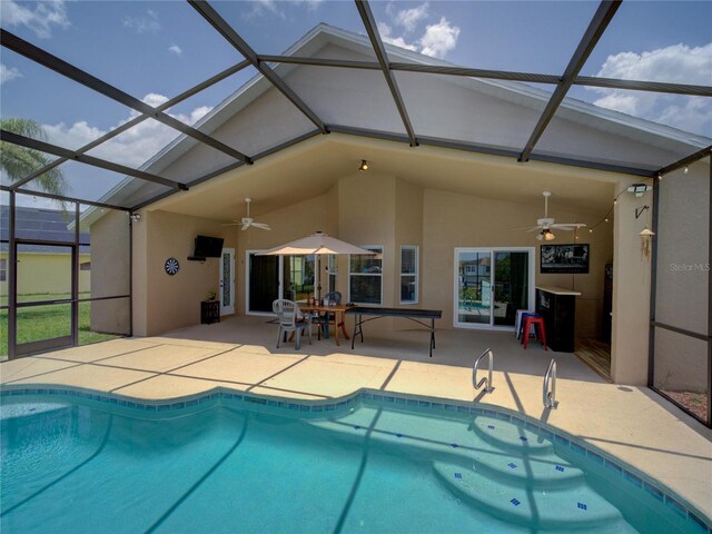 456 Old Bridge Cir, Davenport, FL 33897 - swimming pool with ceiling fan, a patio, and glass enclosure