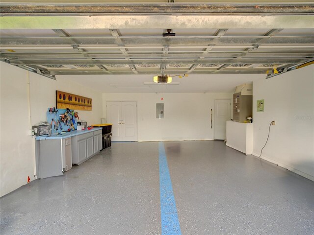 456 Old Bridge Cir, Davenport, FL 33897 - garage featuring a garage door opener and electric panel