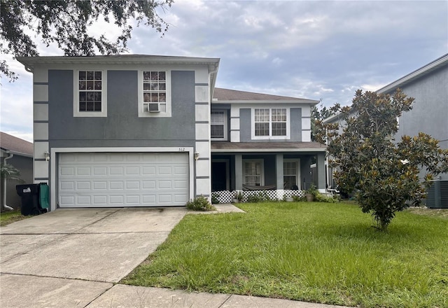 512 Flower Fields Ln, Orlando, FL 32824 - traditional home featuring covered porch, an attached garage, stucco siding, a front yard, and driveway