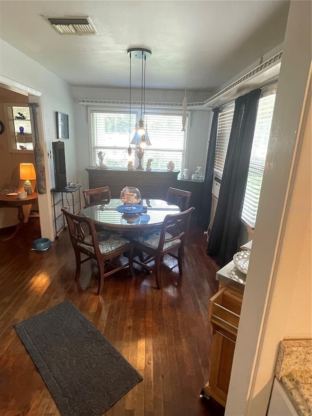 578 3rd St, Daytona Beach, FL 32117 - dining area featuring dark wood-style floors