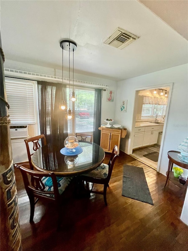 578 3rd St, Daytona Beach, FL 32117 - dining space featuring wood finished floors and cooling unit