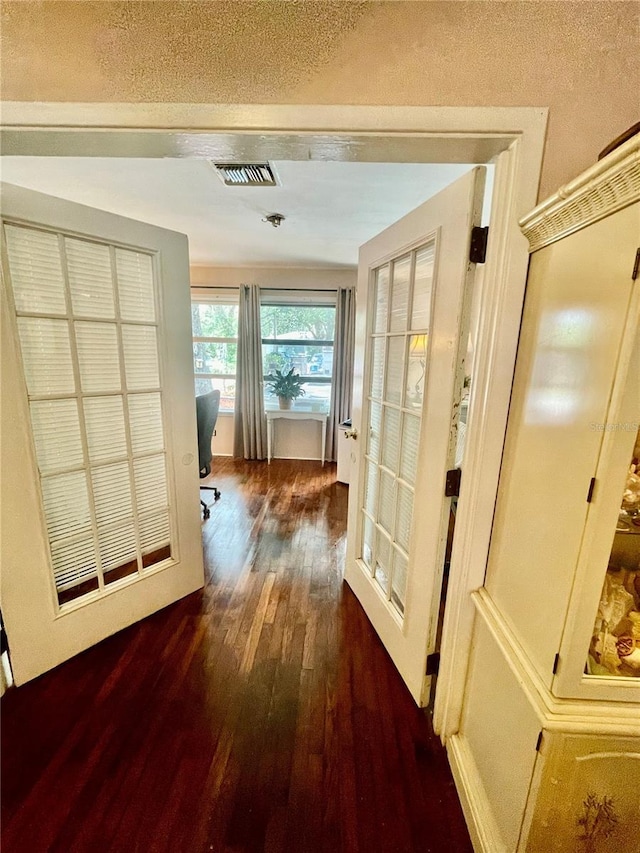 578 3rd St, Daytona Beach, FL 32117 - hall with hardwood / wood-style flooring, a textured ceiling, and an office area