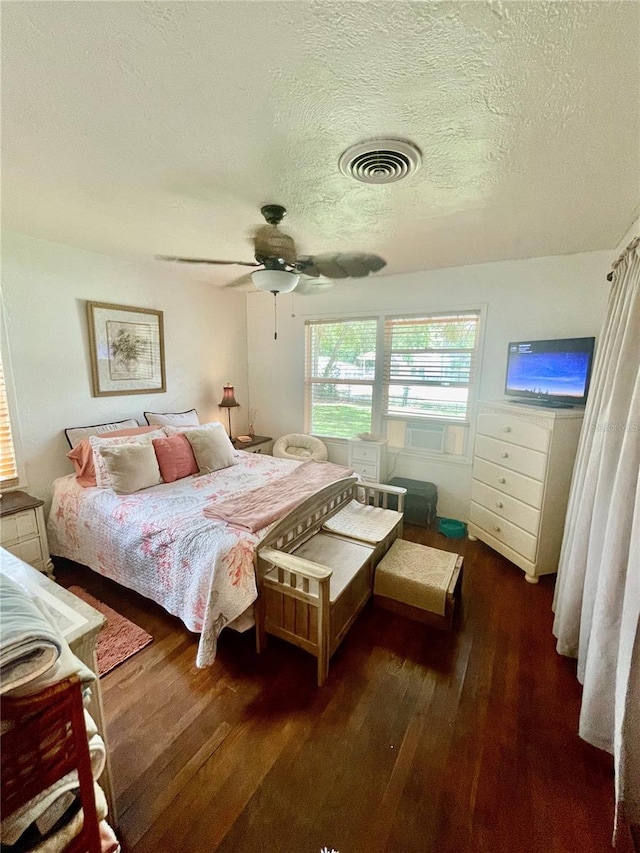 578 3rd St, Daytona Beach, FL 32117 - bedroom featuring hardwood / wood-style flooring, a textured ceiling, and ceiling fan