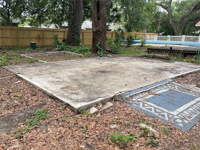 578 3rd St, Daytona Beach, FL 32117 - fenced backyard with a wooden deck