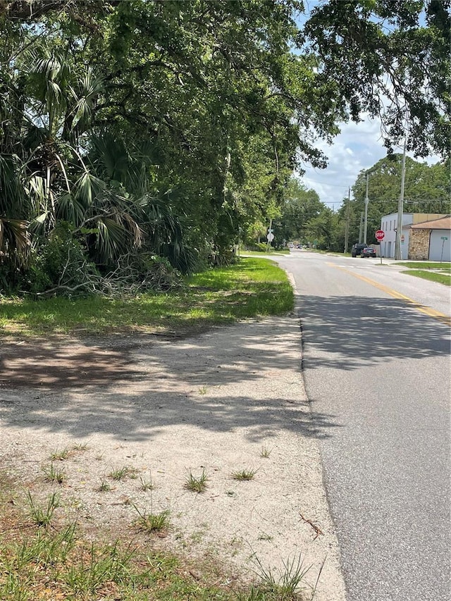 578 3rd St, Daytona Beach, FL 32117 - view of asphalt road featuring traffic signs