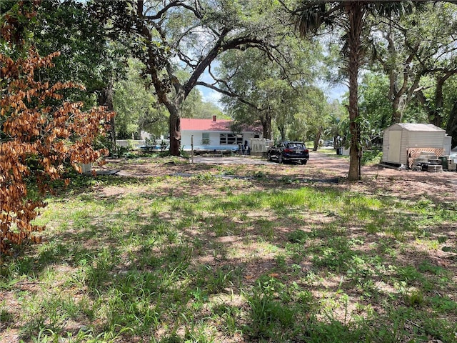 578 3rd St, Daytona Beach, FL 32117 - view of yard with a shed