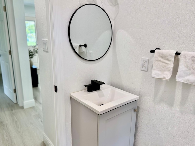 38706 8th Ave, Zephyrhills, FL 33542 - bathroom featuring wood finished floors and vanity