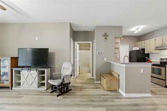 1125 Lake Shadow Cir Unit 5109, Maitland, FL 32751 - kitchen featuring freestanding refrigerator, stainless steel electric stove, under cabinet range hood, and light wood-style floors