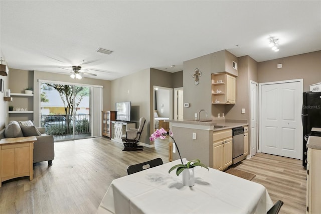 1125 Lake Shadow Cir Unit 5109, Maitland, FL 32751 - kitchen with dishwasher, ceiling fan, open floor plan, light wood-style flooring, and light countertops
