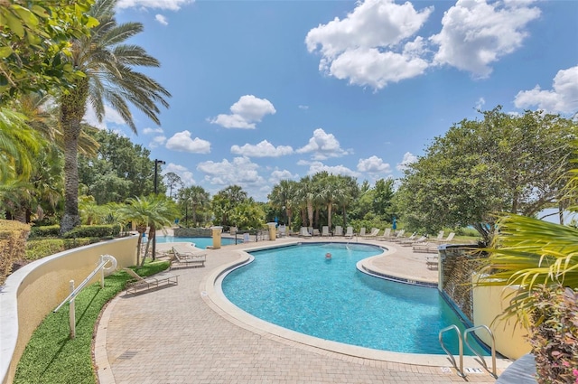 1125 Lake Shadow Cir Unit 5109, Maitland, FL 32751 - community pool with a patio and view of wooded area