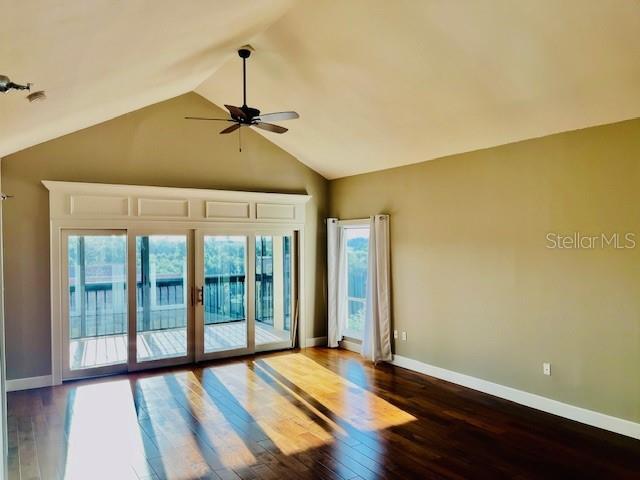 204 Quayside Cir Unit 601, Maitland, FL 32751 - unfurnished room featuring ceiling fan, dark wood-type flooring, and lofted ceiling
