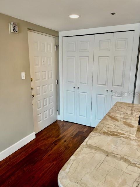 204 Quayside Cir Unit 601, Maitland, FL 32751 - bedroom featuring dark wood-type flooring, a closet, and recessed lighting