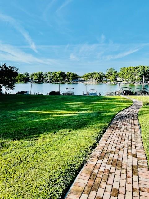 204 Quayside Cir Unit 601, Maitland, FL 32751 - view of home's community with a water view, a lawn, and a dock