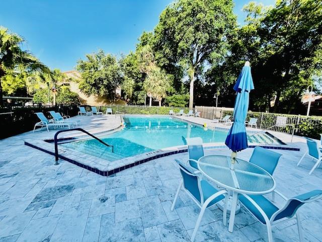 204 Quayside Cir Unit 601, Maitland, FL 32751 - community pool featuring a patio