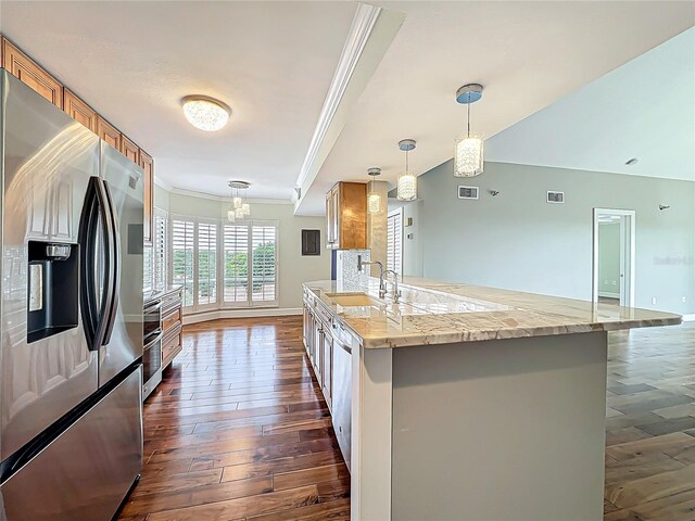 204 Quayside Cir Unit 601, Maitland, FL 32751 - kitchen featuring appliances with stainless steel finishes, crown molding, dark wood-style flooring, decorative light fixtures, and light stone counters