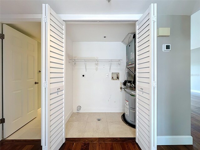 204 Quayside Cir Unit 601, Maitland, FL 32751 - laundry room with washer hookup, electric dryer hookup, and dark tile patterned floors