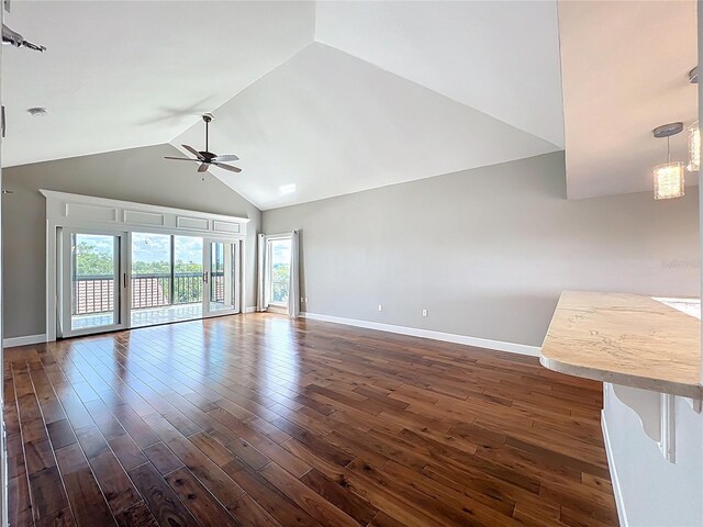 204 Quayside Cir Unit 601, Maitland, FL 32751 - unfurnished living room with a ceiling fan, dark wood-style floors, and high vaulted ceiling