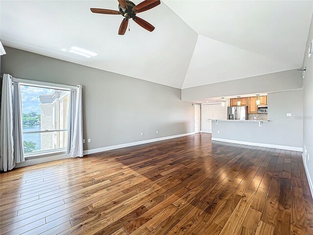 204 Quayside Cir Unit 601, Maitland, FL 32751 - unfurnished living room featuring wood-type flooring, a ceiling fan, and high vaulted ceiling