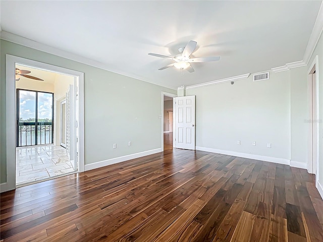 204 Quayside Cir Unit 601, Maitland, FL 32751 - empty room featuring ceiling fan, dark wood-style flooring, and ornamental molding