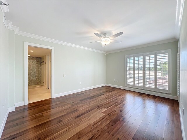 204 Quayside Cir Unit 601, Maitland, FL 32751 - spare room with ceiling fan, ornamental molding, and dark wood-style flooring
