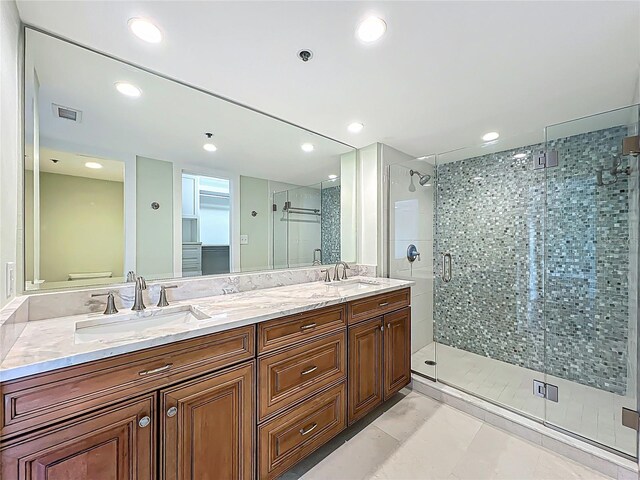 204 Quayside Cir Unit 601, Maitland, FL 32751 - bathroom featuring a shower stall, double vanity, and recessed lighting