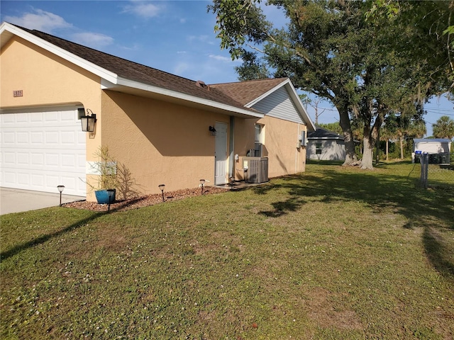 1835 Rival Ter, North Port, FL 34286 - view of side of home featuring stucco siding, a garage, a yard, central air condition unit, and driveway