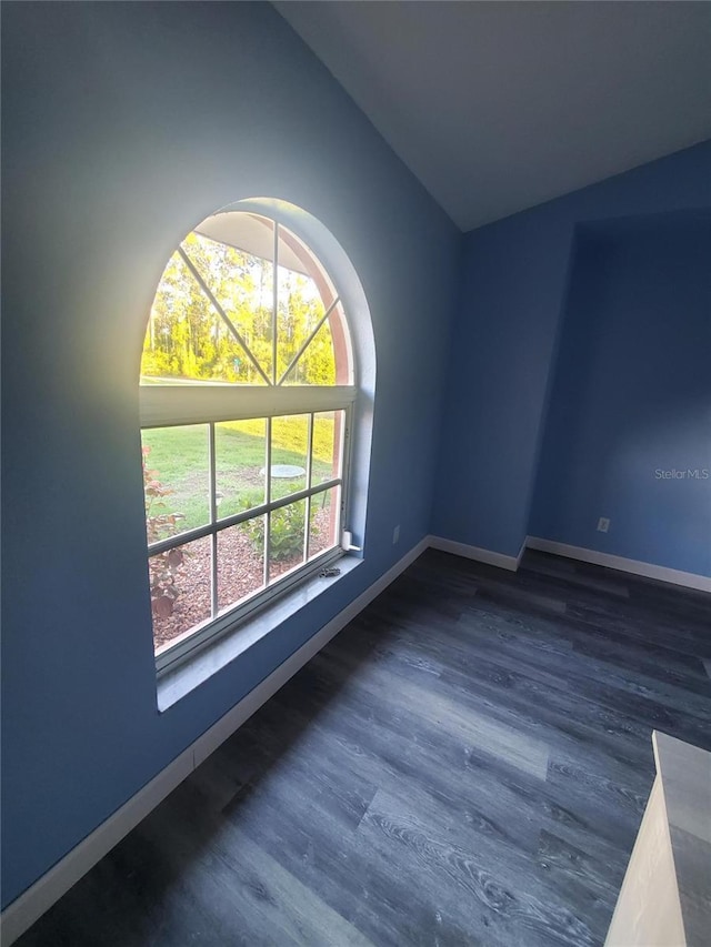 1835 Rival Ter, North Port, FL 34286 - empty room with lofted ceiling, wood finished floors, and baseboards