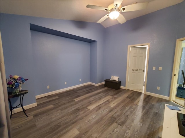 1835 Rival Ter, North Port, FL 34286 - unfurnished bedroom with wood finished floors, lofted ceiling, baseboards, and a ceiling fan