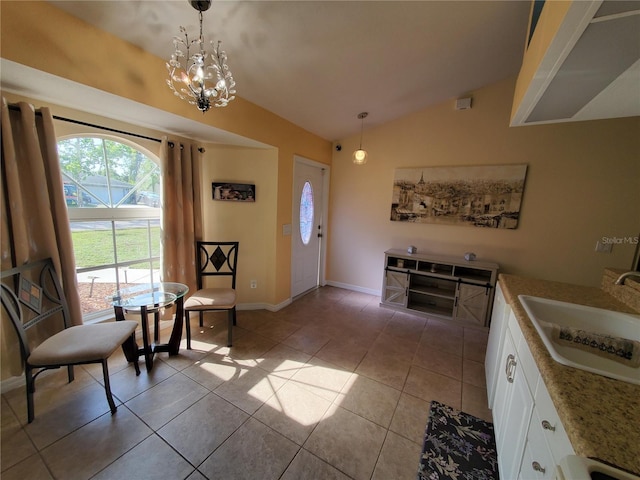 1835 Rival Ter, North Port, FL 34286 - foyer featuring light tile patterned floors, vaulted ceiling, baseboards, and a chandelier