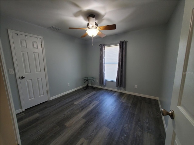 1835 Rival Ter, North Port, FL 34286 - unfurnished room with ceiling fan, dark wood finished floors, and baseboards