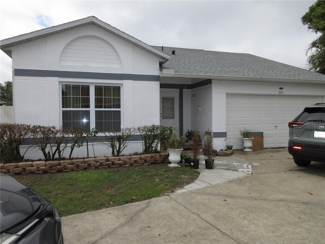 362 White Marsh Cir, Orlando, FL 32824 - view of front of house featuring stucco siding, roof with shingles, a garage, and driveway