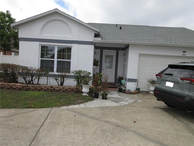 362 White Marsh Cir, Orlando, FL 32824 - ranch-style house with stucco siding, a shingled roof, an attached garage, and concrete driveway