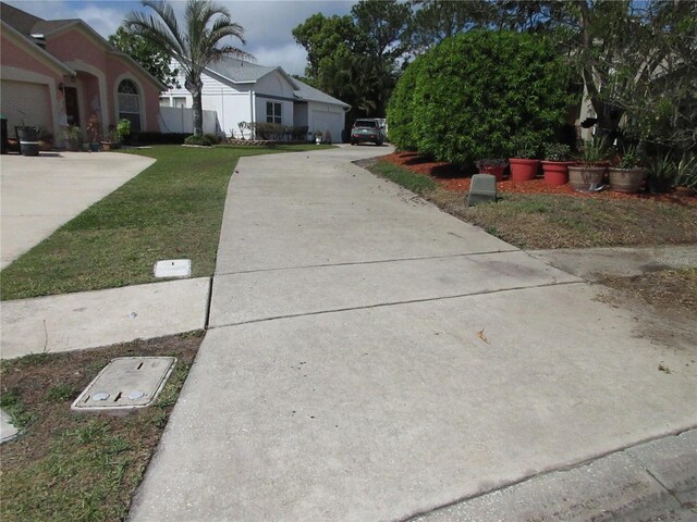362 White Marsh Cir, Orlando, FL 32824 - view of green lawn featuring driveway