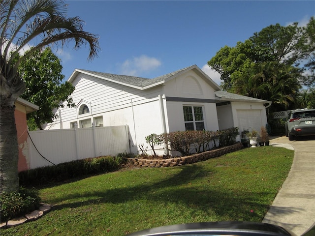 362 White Marsh Cir, Orlando, FL 32824 - view of side of home with an attached garage, concrete driveway, and stucco siding