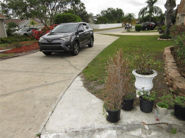 362 White Marsh Cir, Orlando, FL 32824 - view of yard with concrete driveway