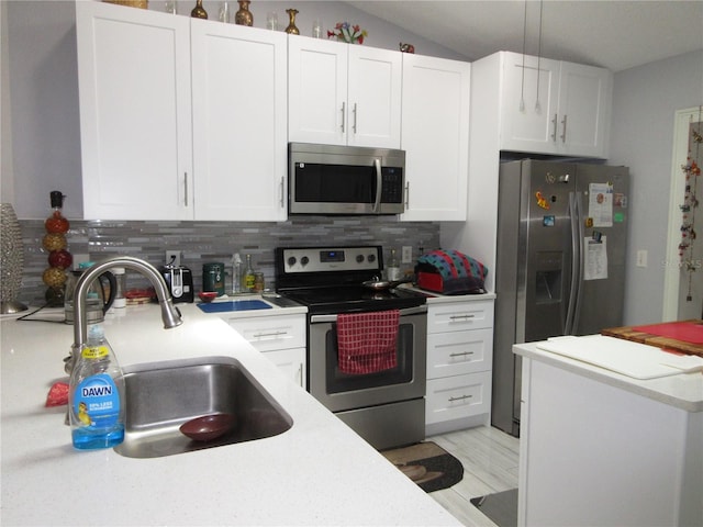 362 White Marsh Cir, Orlando, FL 32824 - kitchen with appliances with stainless steel finishes, decorative backsplash, light countertops, and lofted ceiling