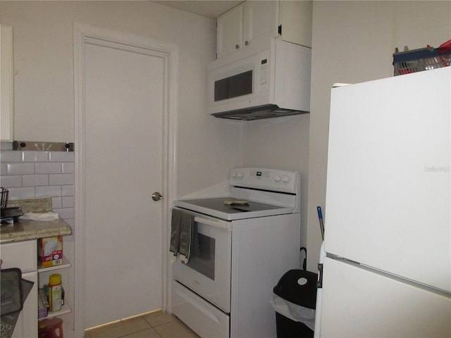 362 White Marsh Cir, Orlando, FL 32824 - kitchen featuring white appliances, white cabinetry, light countertops, and light tile patterned flooring