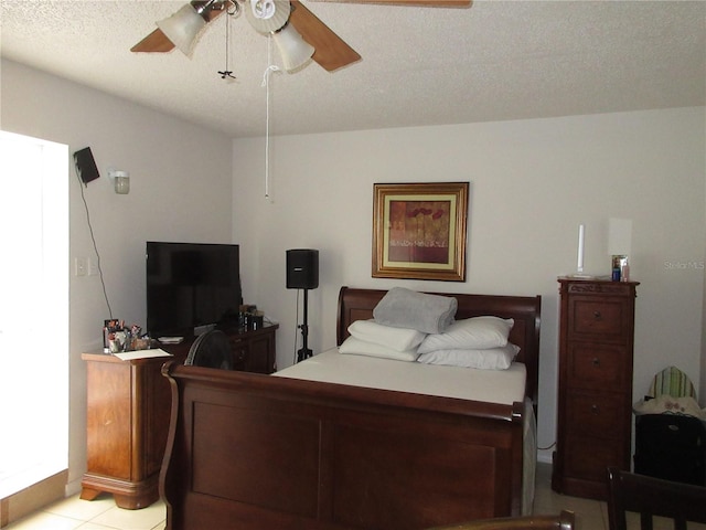 362 White Marsh Cir, Orlando, FL 32824 - bedroom featuring ceiling fan, light tile patterned floors, and a textured ceiling
