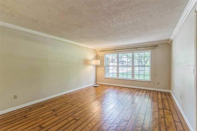 403 Broadview Ave, Altamonte Springs, FL 32701 - spare room featuring ornamental molding, a textured ceiling, and hardwood / wood-style floors