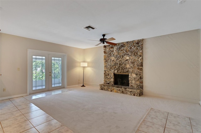 403 Broadview Ave, Altamonte Springs, FL 32701 - unfurnished living room with french doors, a ceiling fan, tile patterned floors, and a fireplace