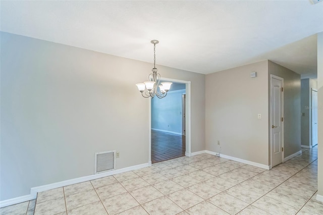 403 Broadview Ave, Altamonte Springs, FL 32701 - empty room with a chandelier and light tile patterned floors