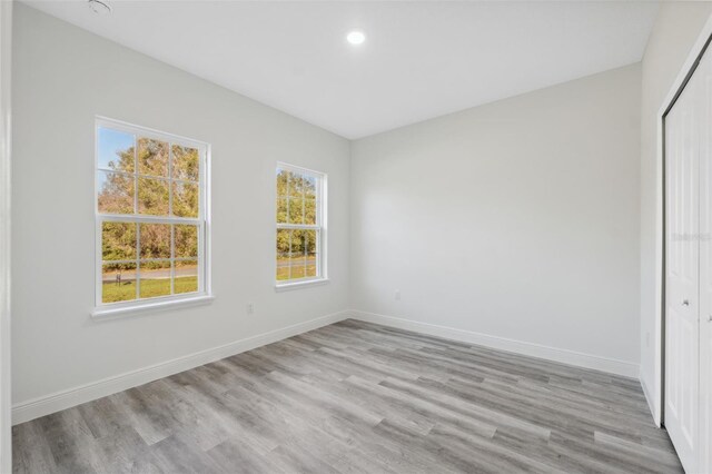 3159 SW 127th Lane Rd, Ocala, FL 34473 - unfurnished bedroom with light wood-style flooring, a closet, and recessed lighting