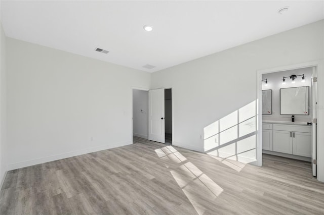 3159 SW 127th Lane Rd, Ocala, FL 34473 - unfurnished bedroom featuring light wood-style floors, ensuite bath, and recessed lighting