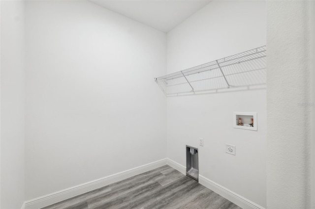 3159 SW 127th Lane Rd, Ocala, FL 34473 - laundry room with electric dryer hookup, wood finished floors, and hookup for a washing machine