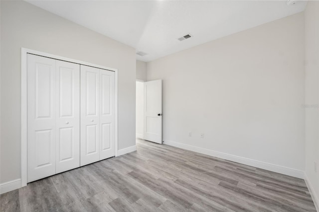 3159 SW 127th Lane Rd, Ocala, FL 34473 - unfurnished bedroom with wood finished floors and a closet