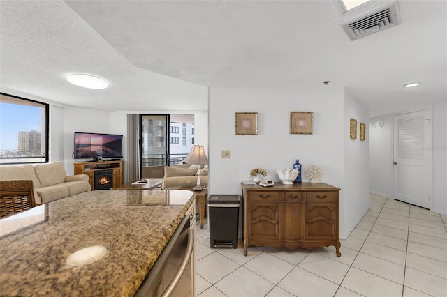 3023 S Atlantic Ave Unit 2050, Daytona Beach, FL 32118 - kitchen with healthy amount of natural light, light tile patterned floors, and open floor plan