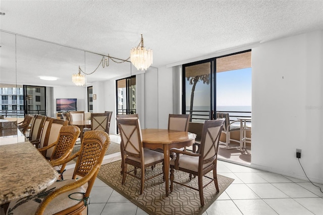 3023 S Atlantic Ave Unit 2050, Daytona Beach, FL 32118 - dining room with a chandelier, a textured ceiling, and light tile patterned floors