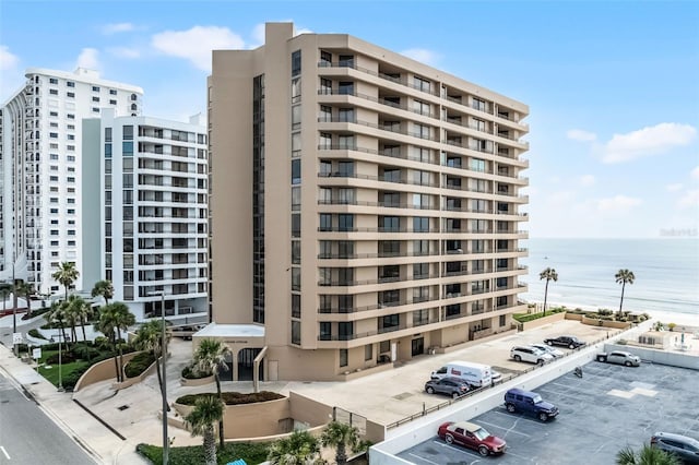 3023 S Atlantic Ave Unit 2050, Daytona Beach, FL 32118 - view of apartment building / complex featuring uncovered parking and a water view