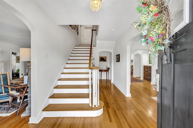 624 Richmond St, Orlando, FL 32806 - foyer with stairs, light wood-type flooring, and arched walkways
