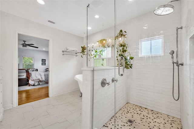 624 Richmond St, Orlando, FL 32806 - ensuite bathroom with a shower stall, a freestanding tub, recessed lighting, marble look tile flooring, and a ceiling fan